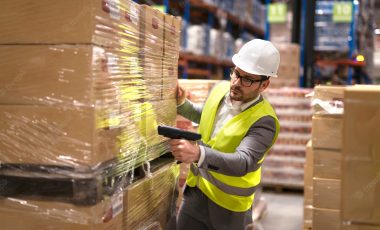 male-warehouse-worker-using-bar-code-scanner-analyze-newly-arrived-goods-further-placement-storage-department_342744-1486